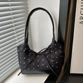 Classic black quilted shoulder bag with white bow print and large frontal bow detail - Black