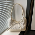 Classic cream bow-embroidered hobo bag with textured fabric and leather base - White