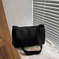 Minimalist black nylon crossbody bag with wide webbing strap and zipper closure - Black