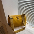 Mustard yellow nylon crossbody bag with adjustable wide strap and knotted zipper detail - Yellow
