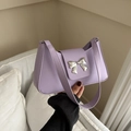 Minimalist light purple baguette shoulder bag with silver bow accent on smooth faux leather - Purple