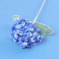 Close-up of handmade crochet blue hydrangea with pearl center and woven leaf detail - Hydrangea Branch / Gradient Dark Blue