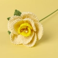 Detailed close-up of handmade crochet yellow rose showing intricate knit texture and petals - French Rose / Yellow