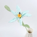Close-up of hand-crocheted light blue lily flower with detailed yarn texture and green stem - Blue (with Bud)
