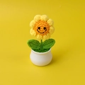 Detail of a handmade crochet sunflower in a white pot with a cute smiling face design - 4-Round Round Corner Yellow Smile Face Potted Plant