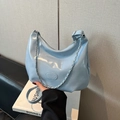 Light blue crescent hobo bag in glossy finish with silver chain and shoulder strap - Blue