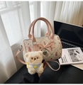 Detail of pink Boston bag with tweed texture, strawberry patterns, and bear charm - Single Bag / Pink