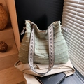 Light green canvas tote bag with fringed edges and a geometric pattern woven strap - Green