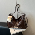 Dark brown patent leather tote bag with glossy finish and plush bear charm accent - Single Bag / Brown