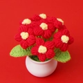 Macro shot of handmade crochet flower pot with red and yellow blossoms for home decor - 7 Puff Flowers Potted / Red (White Pot)