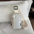 Off-white nylon crossbody chest bag with adjustable strap and minimalist sporty design - White