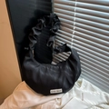 Black crescent dumpling bag with ruched bubble strap and Believe in yourself label - Black