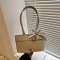 Minimalist beige tote bag featuring a black and white checkered bow detail and long straps - Khaki