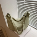 Light green corduroy dumpling bag for women with adjustable strap and moon shape design - Green
