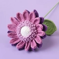 Macro detail of hand-knitted sunflower with purple petals and soft yarn textures - Gradient Purple