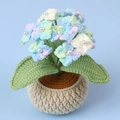 Detail of crochet hydrangea petals with pearl beads and white yarn pot in soft colors - Gradient Blue