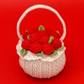 Handmade crochet basket featuring red roses and green leaves in a cream-white knit pot - Red