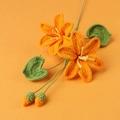 Handmade crochet orange lily bouquet with vibrant green leaves for home decoration - Orange