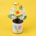 Handmade crochet flower pen holder featuring yellow rose and bee on a white woven base - Gradient Yellow Rose Style