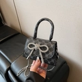 Mini black handbag with rhinestone bow and crossbody silver chain strap for women - Black