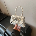 Mini white leather handbag with vintage pattern and sparkling rhinestone bow detail - White