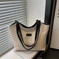Minimalist cream woven tote bag with black leather straps for summer casual style - Black
