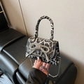 Mini leopard print handbag featuring a sparkling rhinestone bow and silver chain strap - Leopard Black
