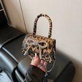 Mini leopard print handbag featuring a sparkling rhinestone bow and silver chain strap - Leopard Brown