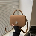 Brown star charm crossbody bag with textured fabric surface and rigid handle - Brown