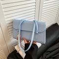 Light blue faux leather French style baguette bag with decorative braided pendant charm - Blue