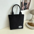 Minimalist black corduroy tote bag with large capacity and casual shoulder strap design - Black