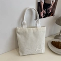 Minimalist beige corduroy tote bag with vertical texture and logo patch for women - White