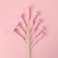 Handmade crochet pink tulip branch with eight detailed flower heads on pink background - Cyrtanthus Flower / Pink
