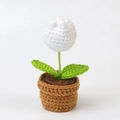 Handmade crochet white tulip potted plant with green leaves and a brown woven base - White Tulip Bonsai In A Mini Yarn Pot