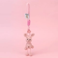 Pink handmade crochet bunny keychain with bell and metal carabiner on pink background - Rabbit With Hanging Legs / Pink