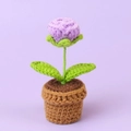 Handmade crochet potted plant featuring a light purple flower in a brown woven base - Purple Bubble Rose Bonsai - Mini Yarn Pot