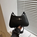 Borsa sottospalla nera intrecciata minimalista con fibbia a stella argento e nodo - Nero