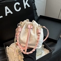 Chic beige drawstring bucket bag with pink braided handle and cute charm accessory - Single Bag / Pink Bag