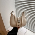 Chic beige crescent hobo bag with silver buckle and adjustable shoulder strap for women - White