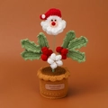 Close-up of handmade crochet Santa flower pot with holly leaves and red berries - Bean Green Leaf Holly Berry Santa / Potted Plant