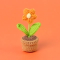 Handmade crochet orange flower potted plant with green leaves and a brown woven pot - Orange-colored Puff Flower Potted Plant - Mini Yarn Pot