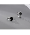 Detail shot of heart-shaped earrings with black enamel and silver metal edges - Vintage Heart Style