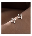 Macro detail of geometric silver studs with polished hollow trapezoid design - Geometric Square Stud Earrings