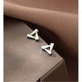 Macro detail of geometric S925 sterling silver triangle stud earrings for women - Geometric Triangle Studs