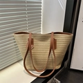 Woven straw tote bag in beige with brown handles and a pink butterfly charm - Khaki