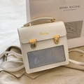 White vintage PU leather ita bag with gold buckles and grey mesh window by Mudanag - Off White