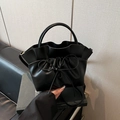 Chic black pleated tote bag with bow detail and adjustable shoulder strap for women - Black