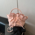 Pink pleated tote bag with bow detail, featuring a soft texture and detachable strap - Pink
