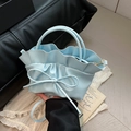 Light blue ruched tote bag with decorative bow and elegant gold-tone hardware detail - Blue