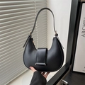 Elegant black crescent shoulder bag with golden hardware and adjustable strap detail - Black